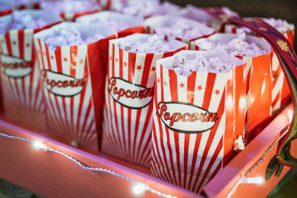 How to Host the Perfect Movie Night With Snacks, Themes, and Setup